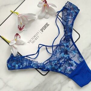 Vs embroidered Butterfly strappy Lace Up Partially open back coverage: